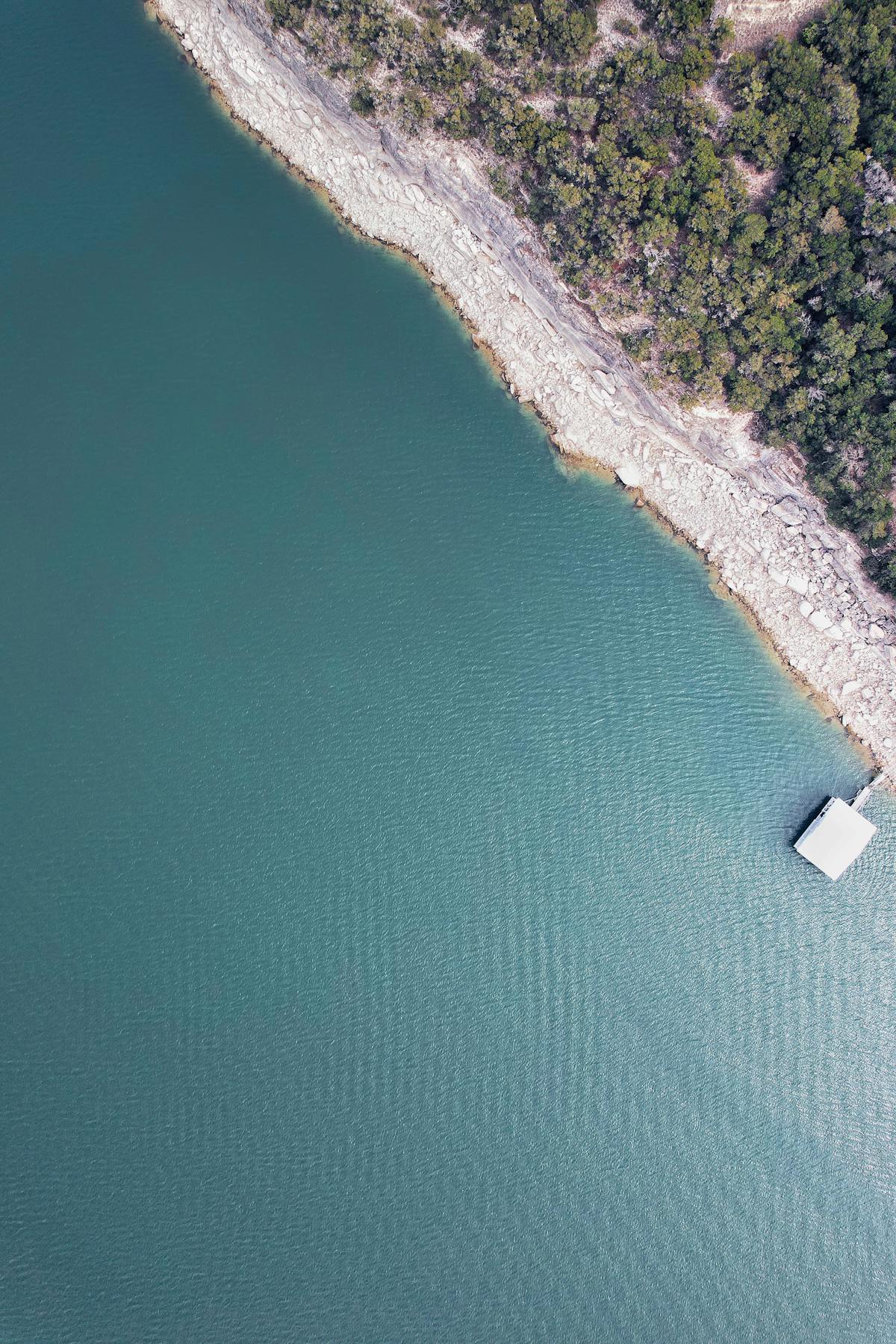 Lake Travis coastline with rocky shore and clear water